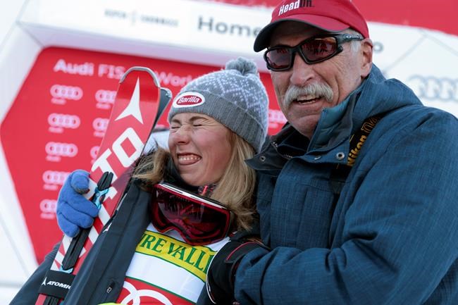 FILE - In this Nov. 28, 2015, file photo, first-place finisher Mikaela Shiffrin, left, poses with her father Jeff Shiffrin after the women's World Cup slalom ski race in Aspen, Colo. Not a day goes by that some image, moment or even song doesn't remind two-time Olympic gold medalist Mikaela Shiffrin of her dad, Jeff, who died February 2020, after an accident at his home in Colorado. (AP Photo/Nathan Bilow, File)