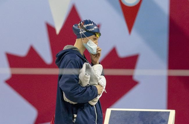 Summer McIntosh arrives for the Women’s 200m Freestyle at the 2020 Olympic Swimming Trials in Toronto, Sunday, June 20, 2021. The 14-year-old McIntosh will be among Canada's youngest Olympians in Tokyo, if not the youngest. THE CANADIAN PRESS/Frank Gunn