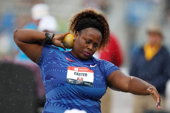 FILE - Michelle Carter sets to throw during the women's shot put at the U.S. Championships athletics meet in Des Moines, Iowa, in this Sunday, July 28, 2019, file photo. Reigning Olympic shot put champion Michelle Carter won't compete at the U.S. track and field trials after having a benign tumor removed from her right ankle. The 35-year-old will cheer on her friends and fellow competitors. (AP Photo/Charlie Neibergall, File)