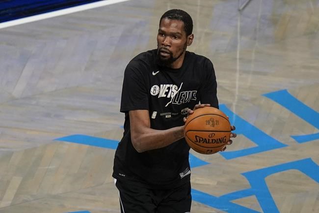 Brooklyn Nets' Kevin Durant warms up before Game 7 of a second-round NBA basketball playoff series Milwaukee Bucks, Saturday, June 19, 2021, in New York. (AP Photo/Frank Franklin II)