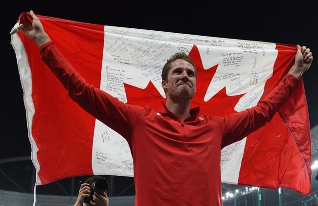 Canada's Derek Drouin celebrates gold in the men's high jump during the 2016 Olympic Summer Games in Rio de Janeiro, Brazil on Tuesday, Aug. 16, 2016. THE CANADIAN PRESS/Sean Kilpatrick