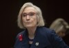 Crown-Indigenous Relations Minister Carolyn Bennett takes her seat as she wait to appear before the Indigenous and Northern Affairs committee in Ottawa on March 10, 2020. Bennett has apologized after she was called out for a one-word text message to Independent Member of Parliament Jody Wilson-Raybould. THE CANADIAN PRESS/Adrian Wyld