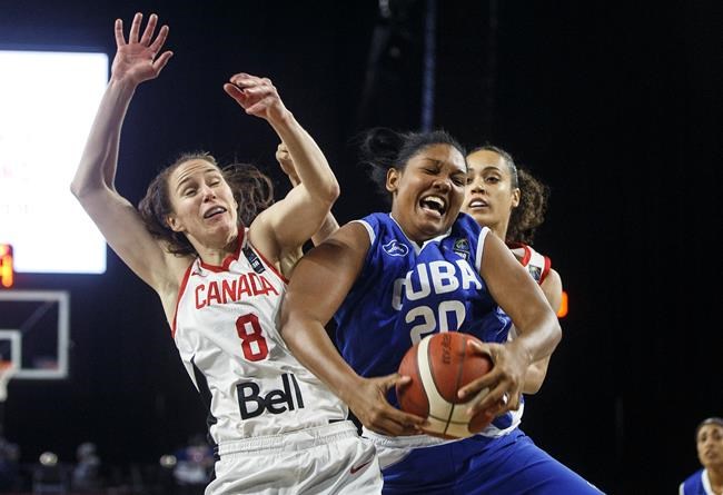 Canada's Kim Gaucher (8) and Cuba's Leanyi Becquer (20) battle for the rebound during first half action of FIBA Women's Olympic Pre Qualifying Tournaments Americas 2019, in Edmonton, Alta., on Thursday November 14, 2019. THE CANADIAN PRESS/Jason Franson