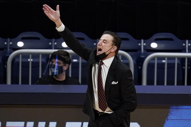 FILE - Iona head coach Rick Pitino gestures as his team plays against Alabama in the first half of a first-round game in the NCAA men's college basketball tournament at Hinkle Fieldhouse in Indianapolis, in this Saturday, March 20, 2021, file photo. Iona coach and Basketball Hall of Famer Rick Pitino is coaching the Greek national team in the Olympic qualifying tournament that starts Tuesday in Victoria, British Columbia. (AP Photo/Michael Conroy, File)