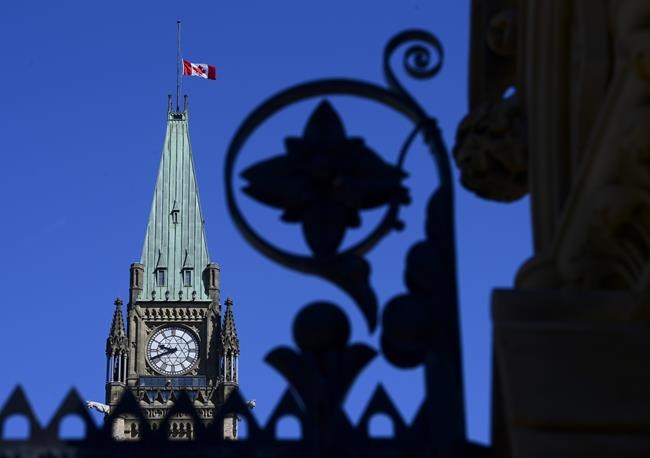 The Canadian flag on the Peace Tower flies at half-mast on Parliament Hill in Ottawa on Wednesday, June 2, 2021. Prime Minister Justin Trudeau says he asked that the national Canadian flag on the Peace Tower remain at half-mast for Canada day as Canadians continue to honour the Indigenous children who died in residential schools. THE CANADIAN PRESS/Sean Kilpatrick