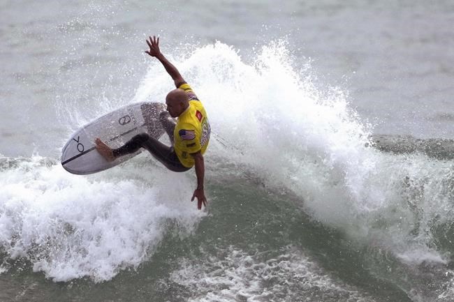 FILE - Surfer Kelly Slater performs during an Olympic exhibition of the USA Surfing Junior championships at the Lower Trestles in San Clemente, Calif., in this Tuesday, June 22, 2021, file photo. There’s a lot riding on surfing’s Olympic debut: a taste of the mainstream spotlight, the athletic legitimacy for the uniquely four-dimensional sport, and, perhaps, some newfound respect so it can finally shake its stereotype as merely the pleasure pursuit of beach town himbos. (Keith Birmingham/The Orange County Register via AP, File)