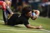 FILE - In this Nov. 28, 2020, file photo, New Zealand's Caleb Clarke is tackled short of the try line during the Tri-Nations rugby test between Argentina and the All Blacks in Newcastle, Australia. All Blacks winger Caleb Clarke has missed selection in the 12-man New Zealand rugby sevens squad for the Tokyo Olympics. Clarke was named Friday, July 2, 2021, as one of three traveling reserves who will accompany the team to Tokyo but will not be eligible for a medal if he doesn’t take the field. (AP Photo/Rick Rycroft, File)