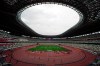 In this May 11, 2021, file photo, athletes compete in the men's 400-meter T20 race during an athletics test event for the Tokyo 2020 Paralympics Games at National Stadium in Tokyo. The pandemic-delayed Tokyo Olympics are shaping up as a TV-only event with few fans — if any — being allowed when they open in just over two weeks. Japan's Asahi newspaper, citing multiple unidentified government sources, says the opening ceremony will be limited only to VIP guests. (AP Photo/Shuji Kajiyama, File)