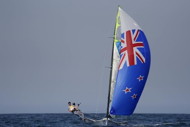 FILE - In this Aug. 15, 2016, file photo, New Zealand's Peter Burling, left, and Blair Tuke compete during their 49er Men race at the Summer Olympics in Rio de Janeiro. As they hit what could be the prime of their careers, Burling, 30, and Tuke, 31, are thinking about more than just their next victory. Sure, they're focusing in on trying to win another gold medal in the high-performance 49er skiff in the Tokyo Olympics starting later this month. They also realize that as the victories pile up, they're in a unique position to speak out about protecting the planet's oceans. (AP Photo/Gregorio Borgia, File)
