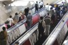 People ride escalators with banners to promote the Tokyo Olympics scheduled to open on July 23, in Tokyo, Tuesday, July 6, 2021. (AP Photo/Koji Sasahara)