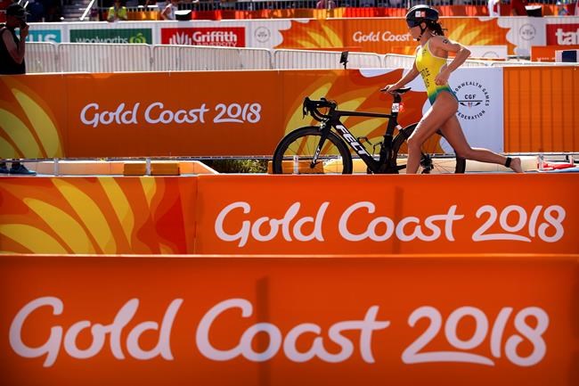 FILE - In this April 7, 2018 file photo, Ashleigh Gentle of Australia competes during the mixed team relay triathlon at the Southport Broadwater Parklands during the 2018 Commonwealth Games on the Gold Coast, Australia. Gentle, is looking forward to possibly representing her country again when the mixed team format makes its Olympic debut in Tokyo. That'll be in addition to her place in the women's individual race. (AP Photo/Mark Schiefelbein, File)