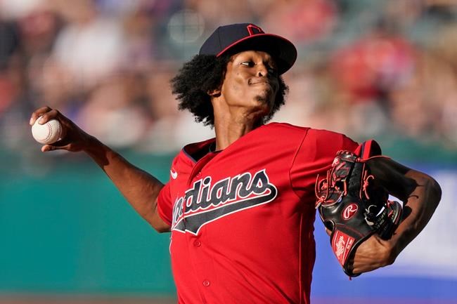 Cleveland Indians starting pitcher Triston McKenzie delivers in the first inning of a baseball game against the Kansas City Royals, Friday, July 9, 2021, in Cleveland. (AP Photo/Tony Dejak)