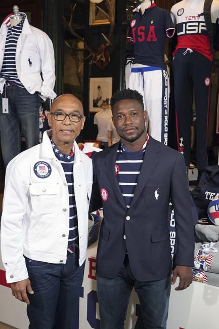 Olympic medalists in fencing, Peter Westbrook, left, and Daryl Homer model the Team USA Tokyo Olympic opening ceremony uniforms at the Ralph Lauren SoHo store on Wednesday, July 7, 2021, in New York. (Photo by Charles Sykes/Invision/AP)