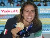 FILE - In this July 23, 2019 file photo, Italy's Simona Quadarella poses with her gold medal after winning the women's 1500m freestyle final at the World Swimming Championships in Gwangju, South Korea. Simona Quadarella is one of the few swimmers capable of challenging American standout Katie Ledecky in the longest pool races at the Tokyo Olympics. The Italian swam to gold in the 1,500-meter freestyle when Ledecky withdrew from the final due to illness at the 2019 world championships. She also stayed with Ledecky until the very last lap of the 800 in 2019 and came away with silver. (AP Photo/Lee Jin-man, file)