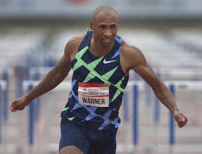 Damian Warner crosses the finish line to win the Men’s 110m hurdles final, Saturday, June 26, 2021 at the Canadian Track and Field Olympic trials in Montreal.THE CANADIAN PRESS/Ryan Remiorz
