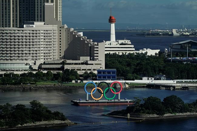 A barge with the Olympic rings mounted on it floats in the water ahead of the 2020 Summer Olympics, Saturday, July 17, 2021, in Tokyo. The one-year postponement of the Tokyo Olympics forced domestic rights-holder CBC to make several significant changes to its planning for the Summer Games. THE CANADIAN PRESS/AP/Jae C. Hong