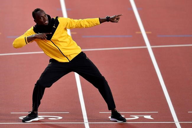Jamaica's Usain Bolt performs his trademark pose during a victory lap to mark his athletics career during the World Athletics Championships in London Sunday, Aug. 13, 2017. THE CANADIAN PRESS/AP/Martin Meissner