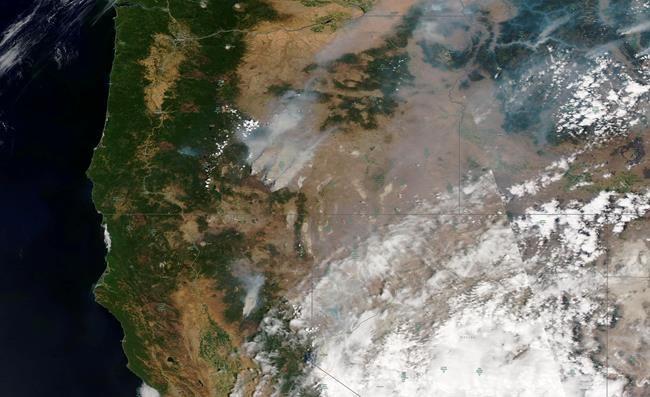 This satellite image provided by Satellite image ©2021 Maxar Technologies shows overview of wildfires from Oregon, Idaho, and Northern California on Sunday, July 18, 2021. Extremely dry conditions and heat waves tied to climate change have made wildfires harder to fight. Climate change has made the West much warmer and drier in the past 30 years and will continue to make weather more extreme and wildfires more frequent and destructive. (Satellite image ©2021 Maxar Technologies via AP)