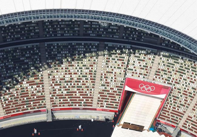In this aerial photo, the Olympic Rings are seen with spectators' seats at the National Stadium in Tokyo Japan, in June, 2021. THE CANADIAN PRESS/AP, Kyodo News