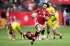 Canada's Nathan Hirayama, front, runs the ball towards the try zone before passing to Harry Jones who scored, during a semifinal match against Australia at the Canada Sevens rugby tournament in Vancouver, on Sunday, March 8, 2020. The wait is finally over for co-captain Hirayama and the Canadian men's rugby sevens team. THE CANADIAN PRESS/Darryl Dyck