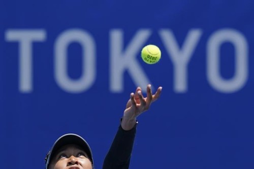 Naomi Osaka, of Japan, practices for the women's tennis competition ahead of the 2020 Summer Olympics, Friday, July 23, 2021, in Tokyo, Japan. Disputed, locked down and running a year late, the Tokyo Games begin at last on Friday night, a multinational showcase of the finest athletes of a world fragmented by disease — and an event steeped in the political and medical baggage of a relentless pandemic whose presence haunts every Olympic corner. (AP Photo/Patrick Semansky)