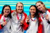Canada's Margaret Mac Neil, left to right, Rebecca Smith, Kayla Sanchez and Penny Oleksiak celebrate a silver medal in the women's 4 x 100m freestyle relay during the Tokyo Olympics in Tokyo, Japan on Sunday, July 25, 2021. THE CANADIAN PRESS/Frank Gunn