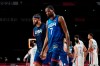 United States' Javale Mc Gee, left, and forward Kevin Durant (7) walk off the court after their loss to France in a men's basketball preliminary round game at the 2020 Summer Olympics, Sunday, July 25, 2021, in Saitama, Japan. (AP Photo/Eric Gay)