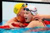 Canada's Margaret Mac Neil celebrates her gold medal swim in the women's 100m butterfly final with Sweden's Sarah Sjoestroem during the Tokyo Olympics in Tokyo, Japan on Monday, July 26, 2021. THE CANADIAN PRESS/Frank Gunn