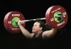 FILE - In this April 9, 2018, file photo, New Zealand's Laurel Hubbard lifts in the snatch of the women's 90kg weightlifting final at the 2018 Commonwealth Games on the Gold Coast, Australia. Hubbard, a transgender woman, is competing in weightlifting for New Zealand (AP Photo/Mark Schiefelbein, File)