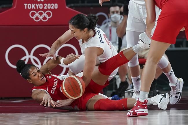 Team Canada forward Miranda Ayim (9) battles for the ball against Team Serbia forward Jelena Brooks (9) during second half Olympic basketball action at the Tokyo Olympics in Tokyo, Japan on Monday, July 26, 2021. THE CANADIAN PRESS/Nathan Denette