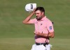 Canada's Corey Conners acknowledges the crowd as her completes his third round on the 18th green at the British Open Golf Championship at Royal St George's golf course Sandwich, England, Saturday, July 17, 2021. THE CANADIAN PRESS/AP/Ian Walton