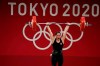 Maude G. Charron of Canada celebrates after a lift in the women's 64kg weightlifting event, at the 2020 Summer Olympics, Tuesday, July 27, 2021, in Tokyo, Japan. THE CANADIAN PRESS/AP/Luca Bruno