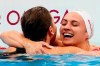 Canada's Kylie Masse embraces gold medal winner, Australia's Kaylee McKeown, after competing to win silver in the women's 100m backstroke final event during the Tokyo Summer Olympic Games, in Tokyo, Tuesday, July 27, 2021. THE CANADIAN PRESS/Frank Gunn