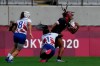 Canada's Charity Williams is tackled by France's Seraphine Okemba, in their women's rugby sevens match at the 2020 Summer Olympics, Friday, July 30, 2021 in Tokyo, Japan. (AP Photo/Shuji Kajiyama)