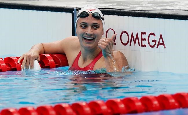 Canada's Kylie Masse celebrates a silver medal in the women's 200m backstroke final during the Tokyo Summer Olympic Games, in Tokyo, Saturday, July 31, 2021. THE CANADIAN PRESS/Adrian Wyld