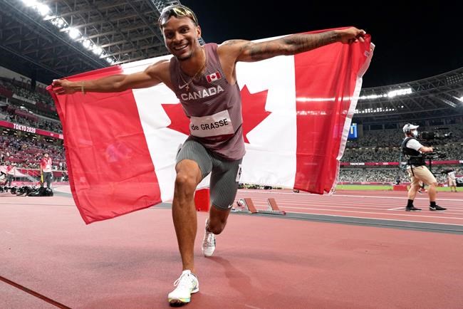 Andre De Grasse of Canada reacts after winning the bronze medal in the Men's 100m final during the summer Tokyo Olympics in Tokyo, Japan on Sunday, August 1, 2021. THE CANADIAN PRESS/Frank Gunn
