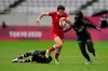 Canada's Britt Benn, center, is chased by Kenya's Grace Okulu, right, while evading a tackle by Kenya's Sinaida Omondi, in their women's rugby sevens 9-10 placing match at the 2020 Summer Olympics, Saturday, July 31, 2021 in Tokyo, Japan. THE CANADIAN PRESS/AP, Shuji Kajiyama