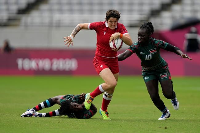 Canada's Britt Benn, center, is chased by Kenya's Grace Okulu, right, while evading a tackle by Kenya's Sinaida Omondi, in their women's rugby sevens 9-10 placing match at the 2020 Summer Olympics, Saturday, July 31, 2021 in Tokyo, Japan. THE CANADIAN PRESS/AP, Shuji Kajiyama