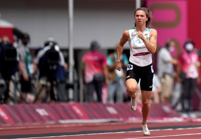 Krystsina Tsimanouskaya, of Belarus, runs in the women's 100-meter run at the 2020 Summer Olympics, Friday, July 30, 2021. Tsimanouskaya alleged her Olympic team tried to remove her from Japan in a dispute that led to a standoff Sunday, Aug. 1, at Tokyo’s main airport. An activist group supporting Tsimanouskaya said she believed her life was in danger in Belarus and would seek asylum with the Austrian embassy in Tokyo. (AP Photo/Petr David Josek)