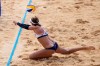 April Ross, of the United States, dives for a shot during a women's beach volleyball match against Germany at the 2020 Summer Olympics, Tuesday, Aug. 3, 2021, in Tokyo, Japan. (AP Photo/Felipe Dana)