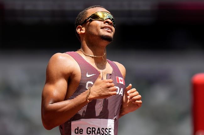 Canada's Andre De Grasse competes in a heat of the men's 200-metres at the 2020 Summer Olympics, Tuesday, Aug. 3, 2021, in Tokyo. (AP Photo/Petr David Josek)