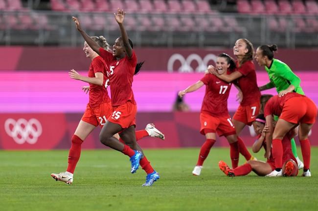 Canada's players celebrate after winning 1-0 to United States during a women's semifinal soccer match at the 2020 Summer Olympics, Monday, Aug. 2, 2021, in Kashima, Japan. THE CANADIAN PRESS/AP-Fernando Vergara