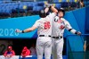 United States' Tyler Austin (23) celebrates his home run with teammate Triston Casas (26) in the fifth inning of a baseball game against the Dominican Republic at the 2020 Summer Olympics, Wednesday, Aug. 4, 2021, in Yokohama, Japan. (AP Photo/Sue Ogrocki)