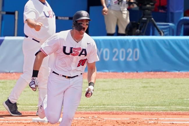 United States' Triston Casas (26) shouts as he rounds first base after hitting a home run in the first inning of a baseball game against the Dominican Republic at the 2020 Summer Olympics, Wednesday, Aug. 4, 2021, in Yokohama, Japan. (AP Photo/Sue Ogrocki)