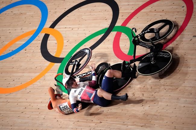 Katy Marchant of Team Great Britain crashes with Laurine van Riessen of Team Netherlands (188) during the track cycling women keirin at the 2020 Summer Olympics, Thursday, Aug. 5, 2021, in Izu, Japan. (AP Photo/Christophe Ena)