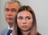 Belarusian dissident in Poland, Pavel Latushka, left, and Belarusian Olympic sprinter Krystsina Tsimanouskaya, right, who came to Poland fearing reprisals at home after criticizing her coaches at the Tokyo Games, talk to journalists in Warsaw, Poland, Thursday, Aug. 5, 2021. (AP Photo/Czarek Sokolowski)