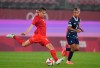 Canada's Quinn, left, prepares to kick the ball during a women's soccer match against Great Britain at the 2020 Summer Olympics, Tuesday, July 27, 2021, in Kashima, Japan. THE CANADIAN PRESS/AP, Fernando Vergara