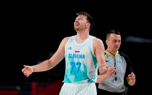 Slovenia's Luka Doncic (77) reacts to a foul call during men's basketball quarterfinal game against Germany at the 2020 Summer Olympics, Tuesday, Aug. 3, 2021, in Saitama, Japan. (AP Photo/Charlie Neibergall)