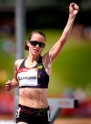Malindi Elmore, from Kelowna, B.C., celebrates winning in the women's 1,500-metre event at the Canadian Track and Field Championships in Calgary, Alta., Friday, June 29, 2012. Elmore will represent Canada at the London 2012 Olympics. THE CANADIAN PRESS/Jeff McIntosh