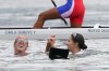 Laurence Vincent Lapointe, back centre, and Katie Vincent celebrate after competing in the women’s canoe double 500m finals during summer Tokyo Olympics in Tokyo, Japan on Saturday, August 7, 2021. Vincent and Vincent Lapointe have won a bronze medal in the women's doubles 500-metre canoe sprint. THE CANADIAN PRESS/Nathan Denette